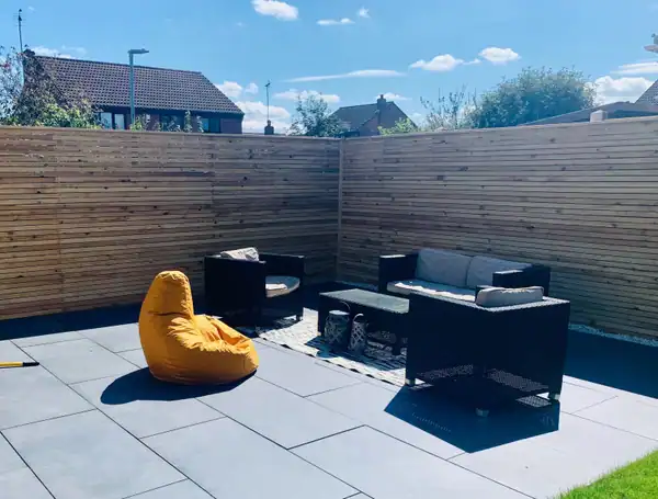 salted fencing with porcelain patio